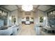 Spacious, light-filled lobby featuring modern furnishings, wood floors, and stylish decor at 17510 Gawthrop Dr # 206, Bradenton, FL 34211