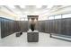 Well-lit locker room with wooden lockers, seating, and tiled flooring for a clean and organized space at 17510 Gawthrop Dr # 206, Bradenton, FL 34211