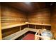 Beautiful wooden sauna with wooden benches and heater with wooden bucket and ladle at 17510 Gawthrop Dr # 206, Bradenton, FL 34211