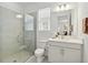 The bathroom features a glass shower, neutral paint, and a modern sink at 17885 Cherished Loop, Bradenton, FL 34211