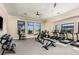Well-equipped gym with treadmills, weights, and large windows for natural light at 17885 Cherished Loop, Bradenton, FL 34211
