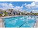 Large community pool with clear blue water, lounge chairs, and well-maintained surroundings at 17885 Cherished Loop, Bradenton, FL 34211