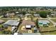 Aerial view of a single-story home featuring a small backyard, fire pit, and additional storage shed at 1789 Elm Dr, Venice, FL 34293
