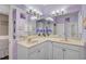 Beautiful bathroom with double sinks, a large mirror, and modern lighting at 1789 Elm Dr, Venice, FL 34293