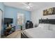 Comfortable bedroom with a cozy bed, stylish decor, and a view to the outside at 1789 Elm Dr, Venice, FL 34293