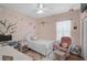 Charming bedroom with playful decor, a comfortable bed, and a cozy reading nook at 1789 Elm Dr, Venice, FL 34293