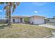 Charming single-story home with a well-maintained lawn and attached two-car garage, inviting curb appeal at 1789 Elm Dr, Venice, FL 34293