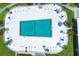 Aerial view of the pool surrounded by lounge chairs and manicured landscaping at 2100 Benjamin Franklin Dr # 201, Sarasota, FL 34236