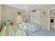 Comfortable bedroom featuring twin beds, ceiling fan, and closet space perfect for a relaxing retreat at 2100 Benjamin Franklin Dr # 201, Sarasota, FL 34236