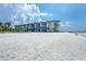 Stunning exterior view of beachfront condominiums with large windows and beautiful architecture at 2100 Benjamin Franklin Dr # 201, Sarasota, FL 34236