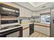 Cozy kitchen with modern appliances and plenty of counter space at 2100 Benjamin Franklin Dr # 201, Sarasota, FL 34236