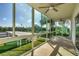 An outdoor patio overlooking beautiful greenery offering a relaxing retreat with plenty of natural light at 2100 Benjamin Franklin Dr # 201, Sarasota, FL 34236