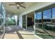An outdoor patio space perfect for enjoying stunning views, equipped with sliding glass doors and ceiling fan at 2100 Benjamin Franklin Dr # 201, Sarasota, FL 34236