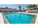 Enjoy a refreshing dip in this sparkling pool surrounded by comfortable lounge chairs at 2100 Benjamin Franklin Dr # 201, Sarasota, FL 34236