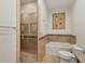 Elegant bathroom featuring a glass shower, soaking tub, and classic tile work at 2221 Bahia Vista St, Sarasota, FL 34239