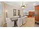 Elegant dining room featuring a stylish chandelier and comfortable seating at 2221 Bahia Vista St, Sarasota, FL 34239