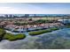 Breathtaking coastal view of stunning waterfront townhomes, offering serene living with ocean access and golf course views at 2282 Harbour Court Dr, Longboat Key, FL 34228