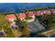 Waterfront property with a tennis court, manicured grounds, and stunning views, offering a luxurious lifestyle at 2282 Harbour Court Dr, Longboat Key, FL 34228