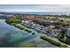Beautiful aerial view of a waterfront community with lush vegetation and boat docks in Sarasota, Florida at 2282 Harbour Court Dr, Longboat Key, FL 34228