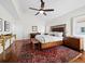 This cozy bedroom boasts hardwood floors, stylish rug and decor, and natural light at 2282 Harbour Court Dr, Longboat Key, FL 34228
