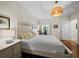 This bright bedroom features a king bed, wood floors, and access to an outdoor space at 2282 Harbour Court Dr, Longboat Key, FL 34228