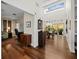 Open hallway featuring wood floors and an open concept floor plan to the office and dining room at 2282 Harbour Court Dr, Longboat Key, FL 34228