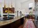 Elegant kitchen with large island, dark wood cabinets, and modern appliances at 2282 Harbour Court Dr, Longboat Key, FL 34228