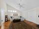 Inviting living room with hardwood floors, vaulted ceiling, fan, and ample natural light at 2282 Harbour Court Dr, Longboat Key, FL 34228