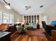 Well-lit office with wood flooring, an accent wall, and a contemporary desk space at 2282 Harbour Court Dr, Longboat Key, FL 34228