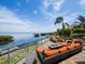 Spacious outdoor patio with comfortable seating, waterfront views, and stylish decor for relaxing and entertaining at 2282 Harbour Court Dr, Longboat Key, FL 34228