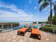 Patio with lounge chairs offers a waterfront view and access to a private dock at 2282 Harbour Court Dr, Longboat Key, FL 34228