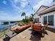 Spacious patio with outdoor seating and a lounge with water view, great for entertaining at 2282 Harbour Court Dr, Longboat Key, FL 34228