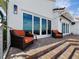 Brick patio with comfortable seating with a bright and airy waterfront view at 2282 Harbour Court Dr, Longboat Key, FL 34228