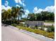 Landscaped community signage for Bay Isles North Longboat Key Club with colorful flowers and foliage at 2282 Harbour Court Dr, Longboat Key, FL 34228