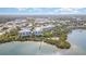 Aerial view of the community showing waterfront condos, private beach access, and surrounding town at 242 Hidden Bay Dr # 603, Osprey, FL 34229
