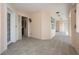 Hallway entrance with neutral paint and ceramic tile flooring leading to a brightly lit interior at 242 Hidden Bay Dr # 603, Osprey, FL 34229