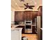 Kitchen boasts stainless steel appliances, granite countertops, and dark wooden cabinets at 242 Hidden Bay Dr # 603, Osprey, FL 34229