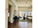 Spacious lobby with hardwood floors leads to an outdoor pool area with comfortable patio furniture at 242 Hidden Bay Dr # 603, Osprey, FL 34229