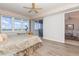 Light filled main bedroom featuring neutral paint, decorative accents, and water views at 242 Hidden Bay Dr # 603, Osprey, FL 34229
