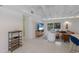 Living room with modern decor, terrazzo flooring, and a sliding glass door leading to the outside at 2560 Sunnyside St, Sarasota, FL 34239