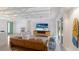 Spacious living room with unique ceiling beams, modern decor, and access to outdoor patio at 2560 Sunnyside St, Sarasota, FL 34239