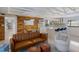 Bright and airy living space with an open concept kitchen and modern coastal design at 2560 Sunnyside St, Sarasota, FL 34239