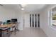 Bright office space featuring a modern desk, ample natural light, and a neutral color palette at 2560 Sunnyside St, Sarasota, FL 34239