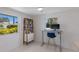 Inviting office space with large windows, neutral walls, and a sleek, functional desk setup at 2560 Sunnyside St, Sarasota, FL 34239