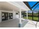 A covered patio offers seamless indoor-outdoor living with a fan and tiled accents at 2560 Sunnyside St, Sarasota, FL 34239
