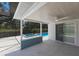 Inviting covered patio featuring a swimming pool and hot tub with tiled accents for outdoor relaxation at 2560 Sunnyside St, Sarasota, FL 34239
