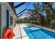 A covered pool and spa area provide a serene outdoor retreat at 2560 Sunnyside St, Sarasota, FL 34239