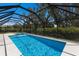 A beautiful screened-in pool and spa offer a refreshing escape in this home at 2560 Sunnyside St, Sarasota, FL 34239