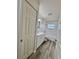 Clean bathroom featuring a shower-over-tub with subway tiles, modern vanity, and updated flooring at 2721 7Th W St, Bradenton, FL 34205