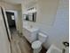 Bathroom featuring a vanity, tile accent wall, and combined shower and tub at 2721 7Th W St, Bradenton, FL 34205